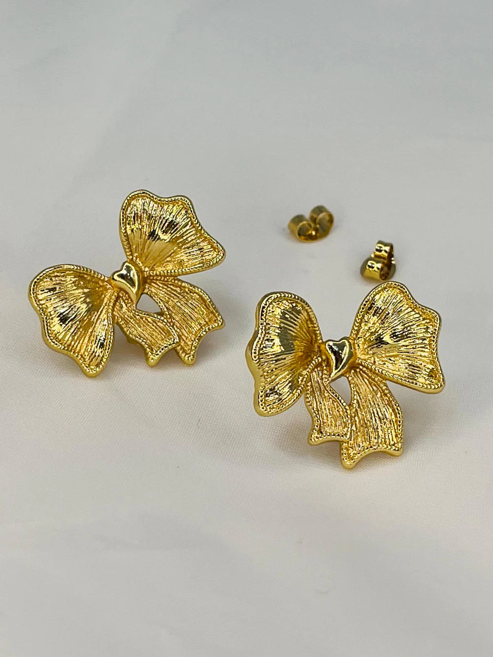 Textured Gold Bow Earrings– Bold Statement Studs with Heart Center | SAHARA SPARKLE