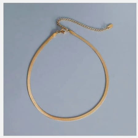Gold herringbone chain necklace with adjustable clasp.
