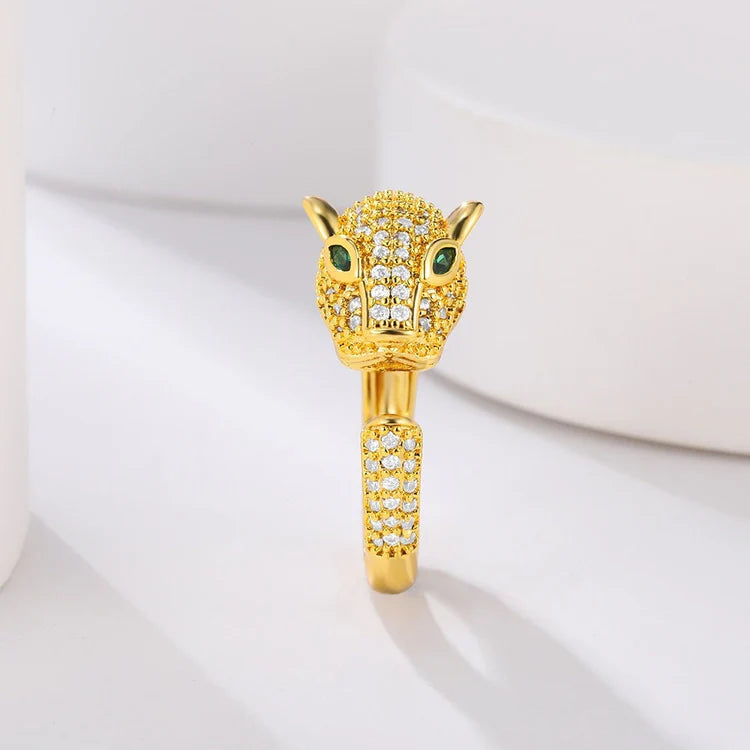 Gold tiger ring with green eyes and crystal accents.