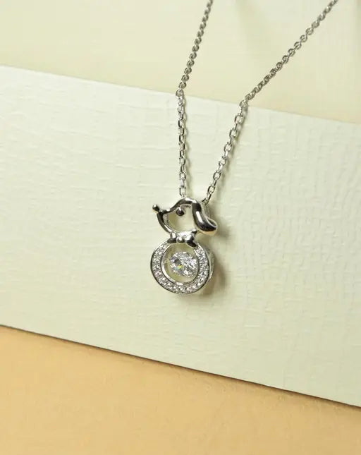 Silver-tone dog pendant necklace with round crystal halo and center stone.