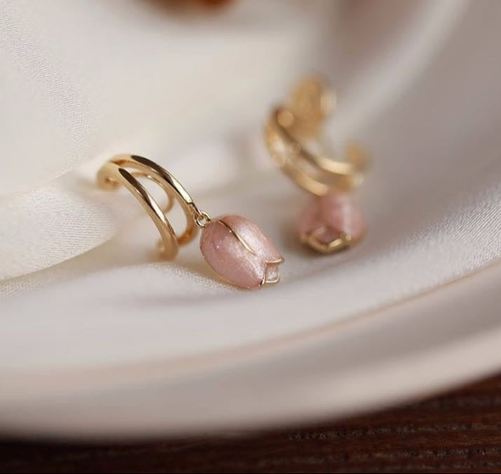 Gold hoop earrings with pink tulip charm